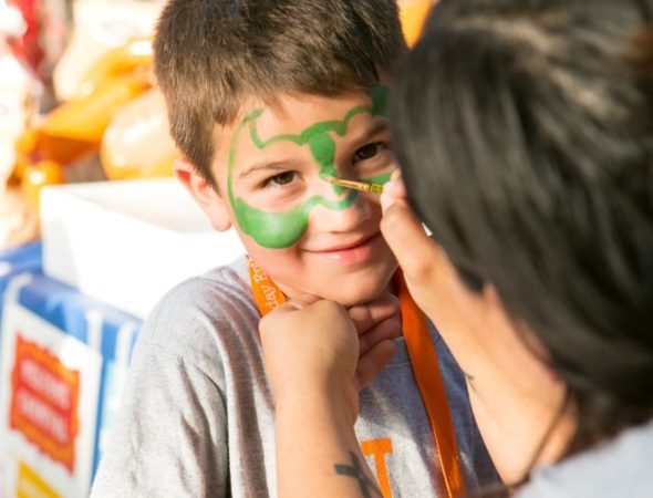 boy getting face painted